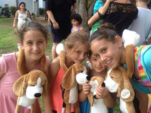 JDC’s Hibuki doll program, which has been used in emergency situations since the Second Lebanon War, makes children the caretakers of a plush, sad-faced Hibuki puppy doll whose long arms can be fastened around a child, embracing them in a comforting hug.