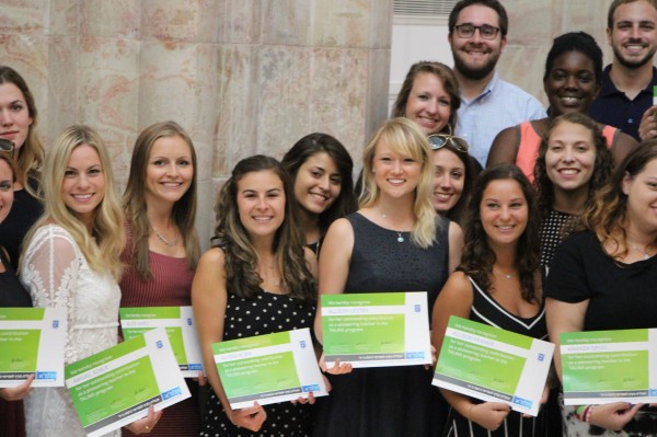 All smiles, holding "Certificates of Thanks,"Abby Soble (far left) with TALMA teachers.