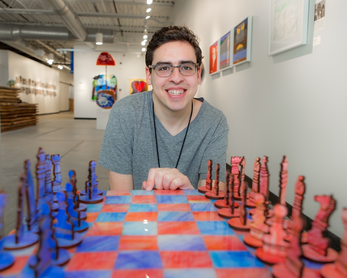 David Kole of West Bloomfield with his chess set, made at the Soul Center.